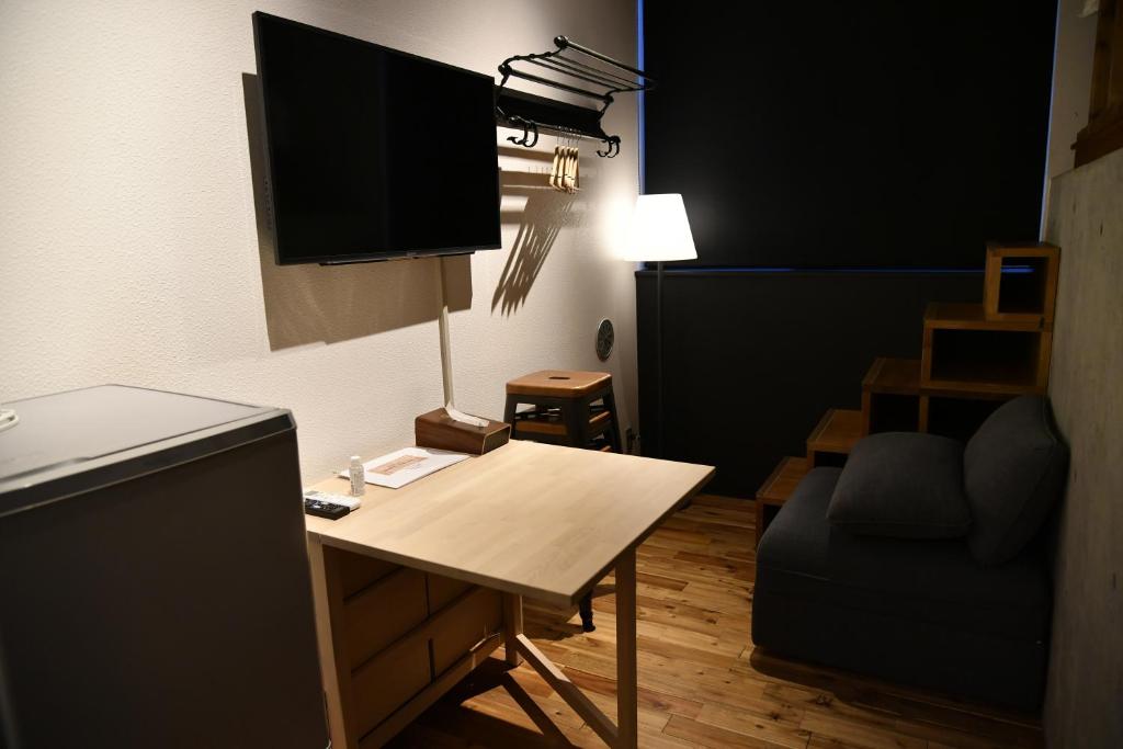 TV a/nebo společenská místnost v ubytování Arcsens Tokyo