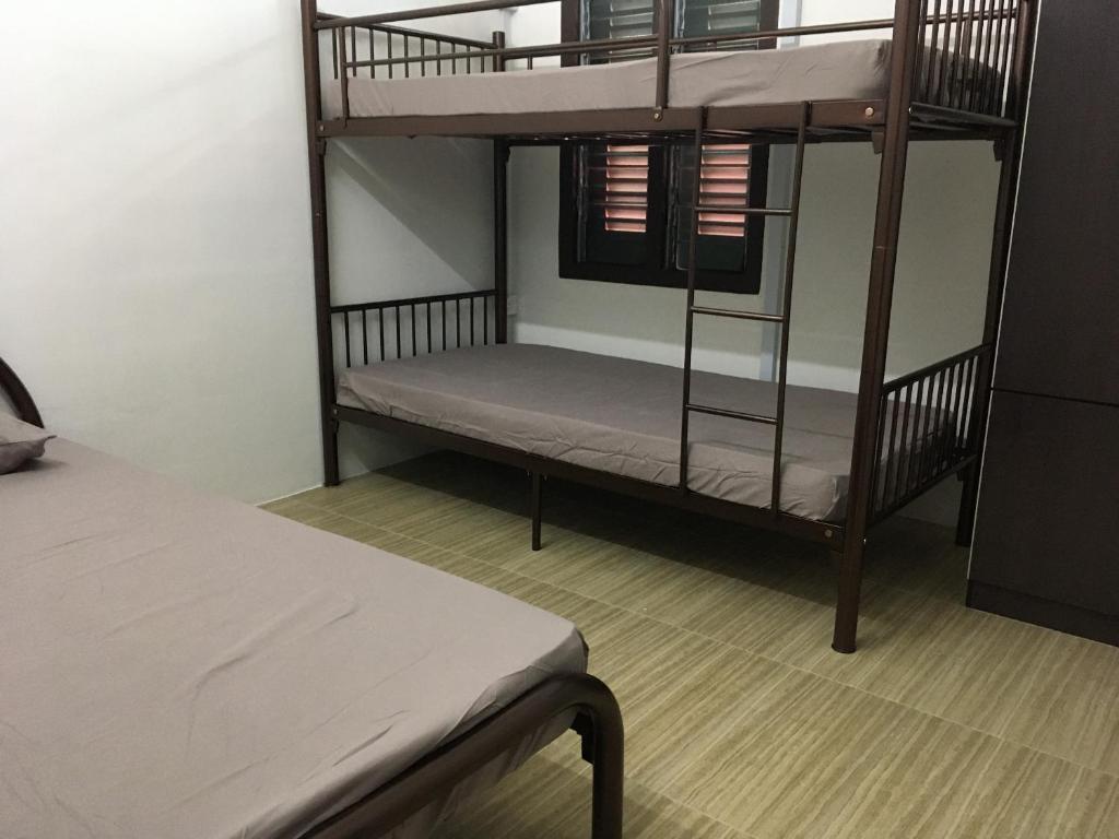 Postel nebo postele na pokoji v ubytování Homey Hostel, Ipoh Town