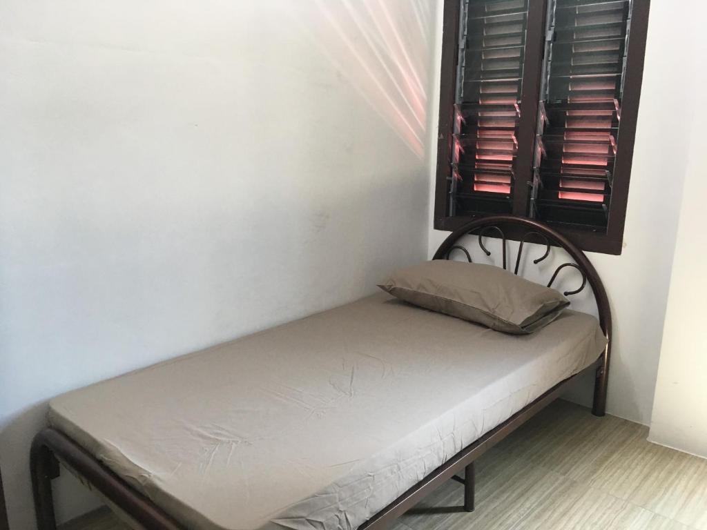 Postel nebo postele na pokoji v ubytování Homey Hostel, Ipoh Town