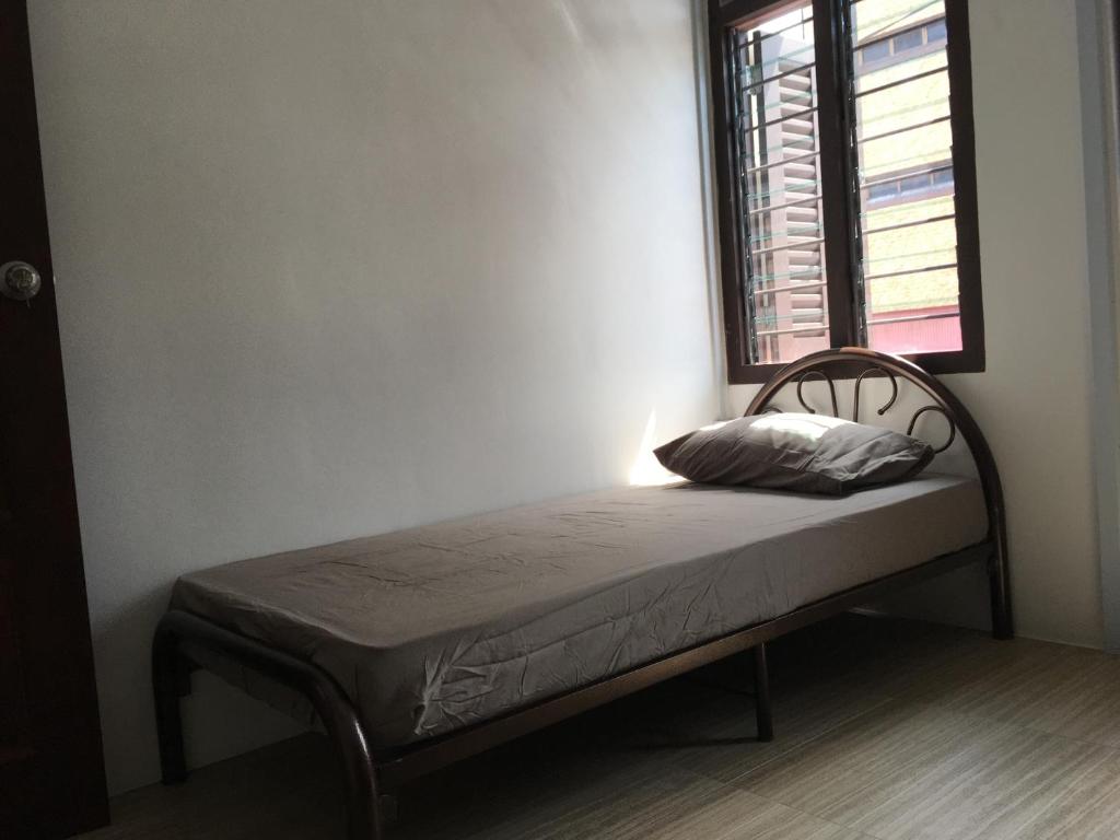Postel nebo postele na pokoji v ubytování Homey Hostel, Ipoh Town