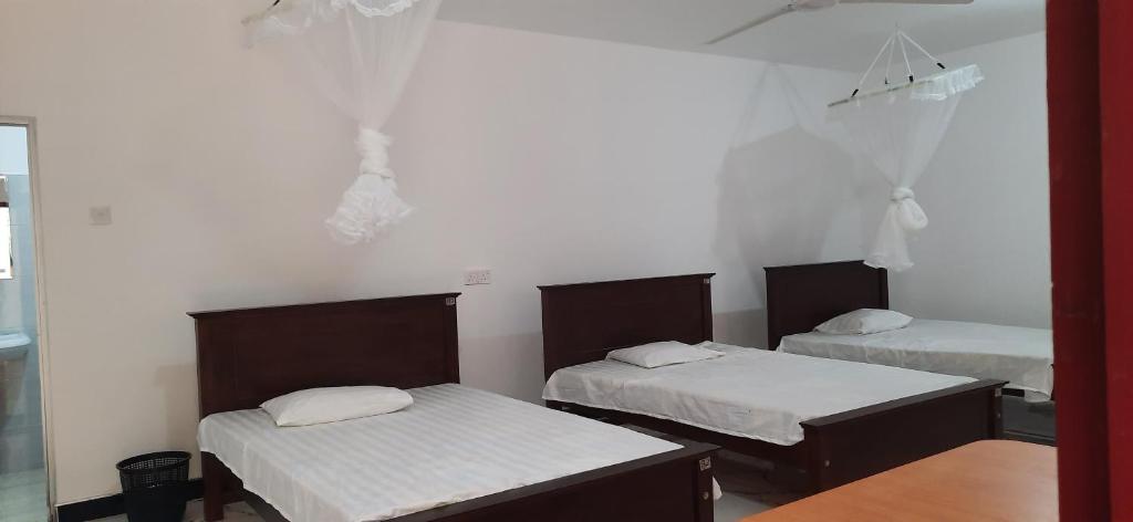 Postel nebo postele na pokoji v ubytování HIKKADUWA REST