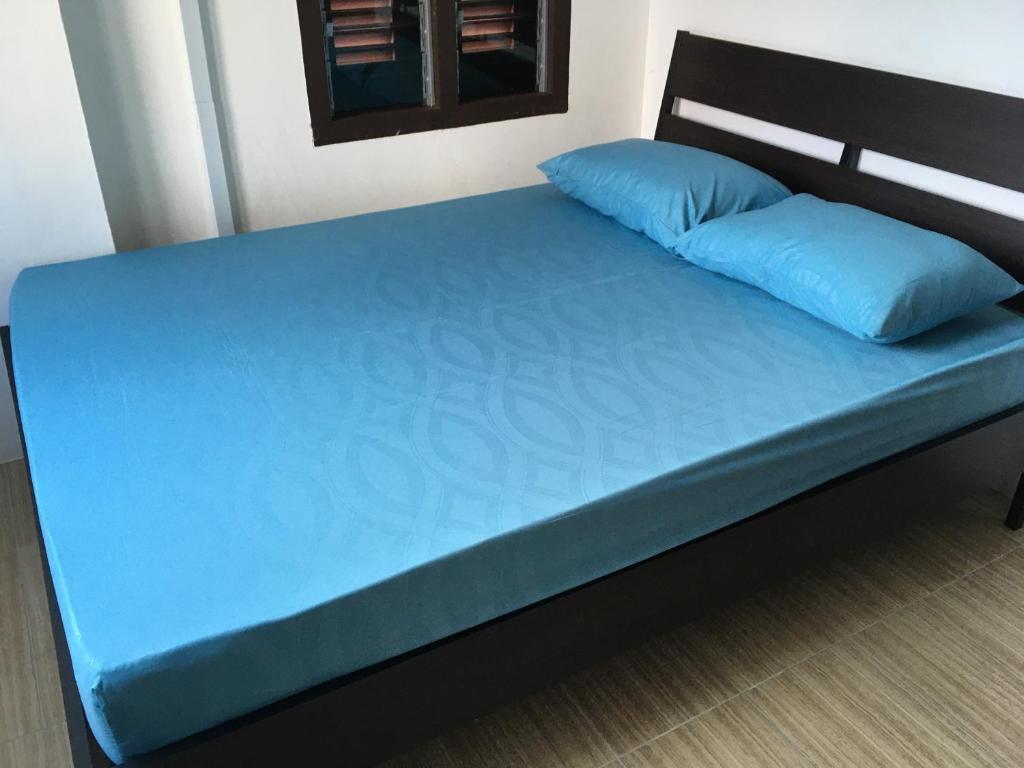 Postel nebo postele na pokoji v ubytování Homey Hostel, Ipoh Town