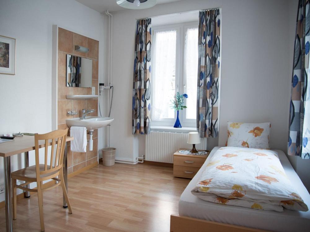 Postel nebo postele na pokoji v ubytování Hotel Restaurant Raben