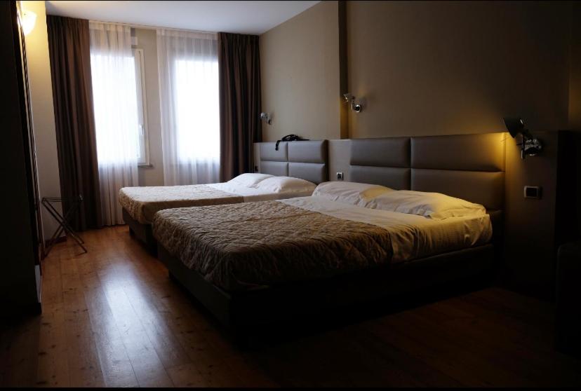 Postel nebo postele na pokoji v ubytování Hotel Rubicone