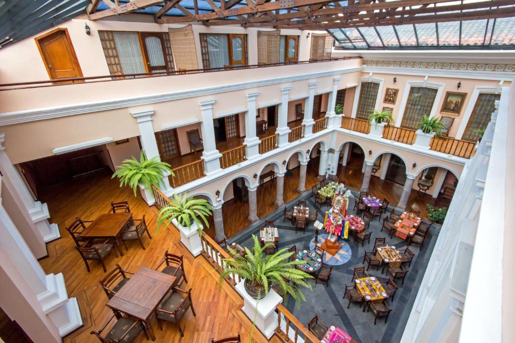 an overhead view of therium of a building with tables and chairs at Hotel Patio Andaluz in Quito