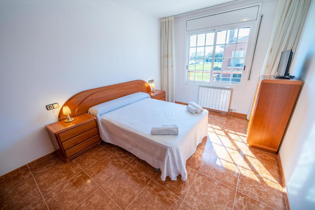 Posteľ alebo postele v izbe v ubytovaní HomeHolidaysRentals Charme - Costa Barcelona