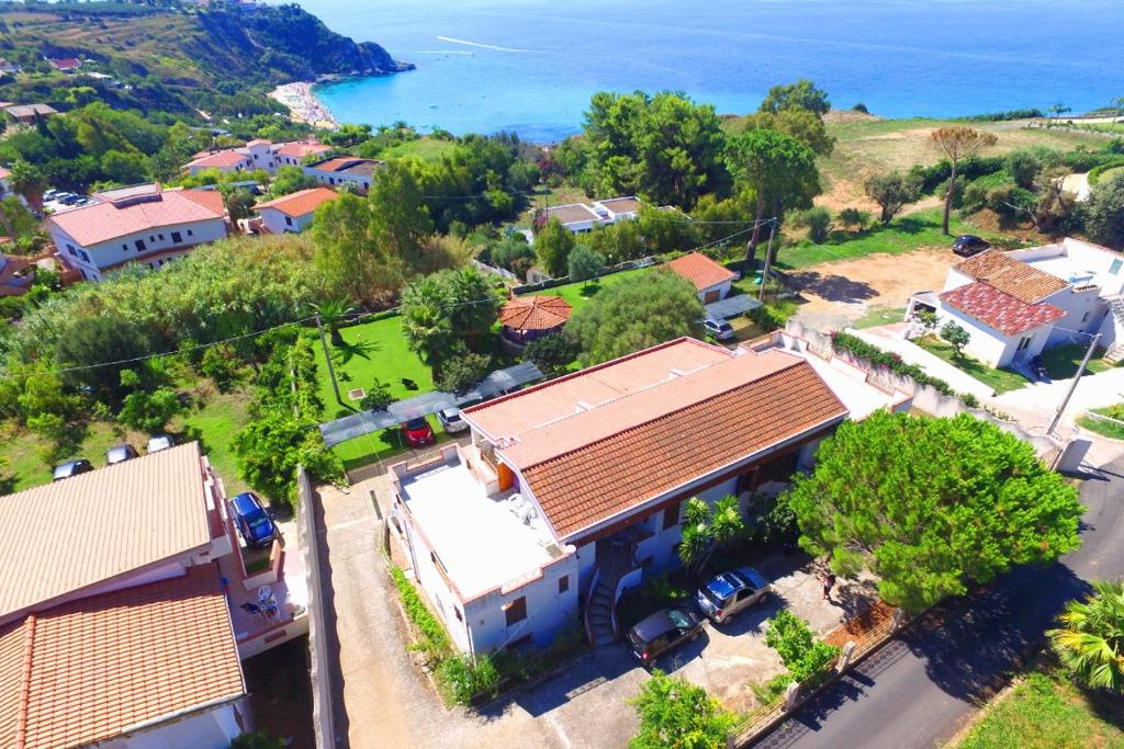 an aerial view of a house with the ocean in the background at Villa Eulalia in Capo Vaticano