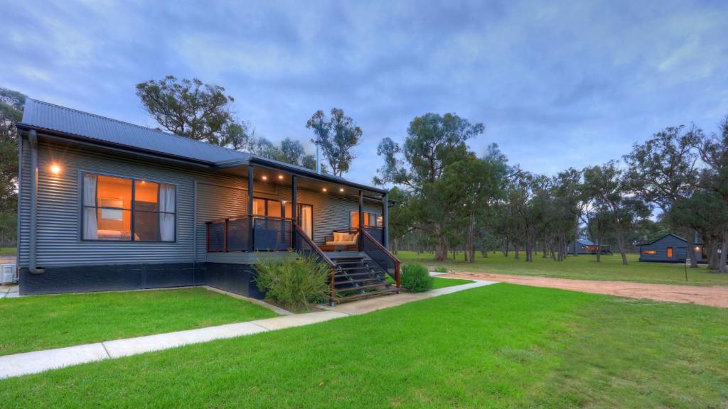 a modular home with a grass yard at Quaffers on Storm King in Stanthorpe
