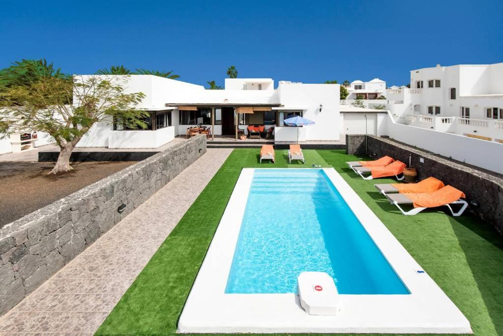 an image of a swimming pool on the roof of a house at Villa Tuco in Teguise