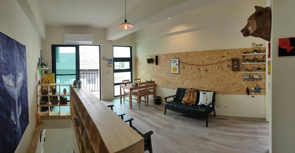 a living room with a counter and a table at Lao Yu Homestay in Taitung City