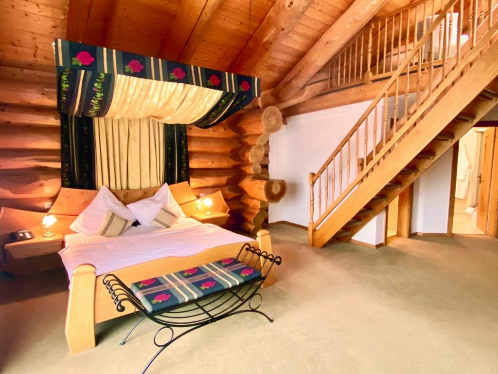 Postel nebo postele na pokoji v ubytování Hotel Sonnenhof Aspach