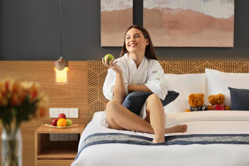Postel nebo postele na pokoji v ubytování Citadines Berawa Beach Bali