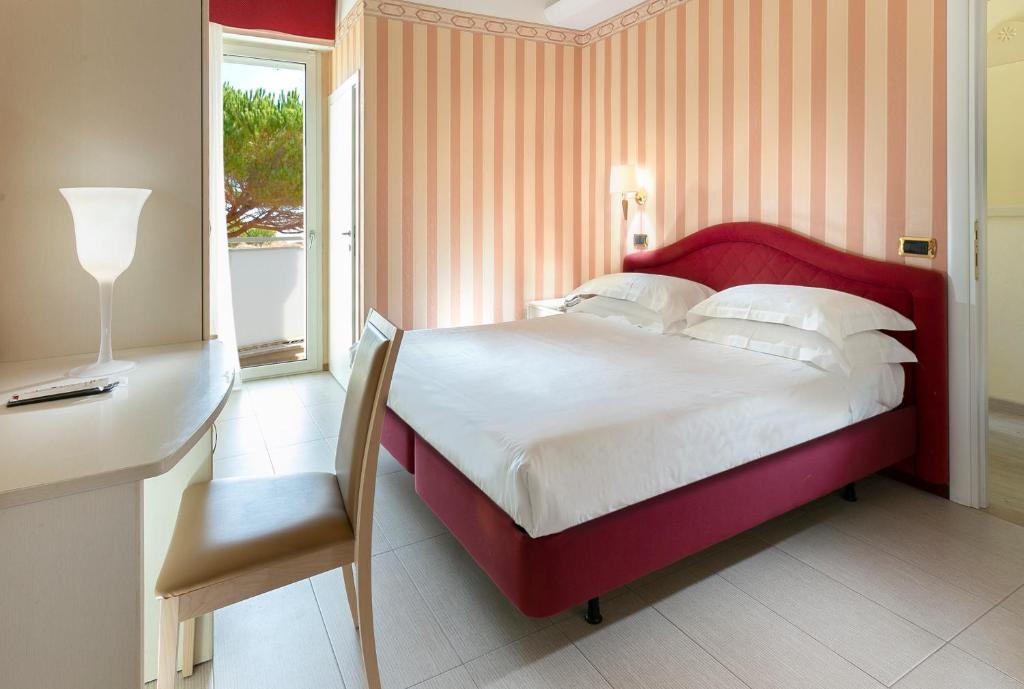 Postel nebo postele na pokoji v ubytování Hotel Bikini