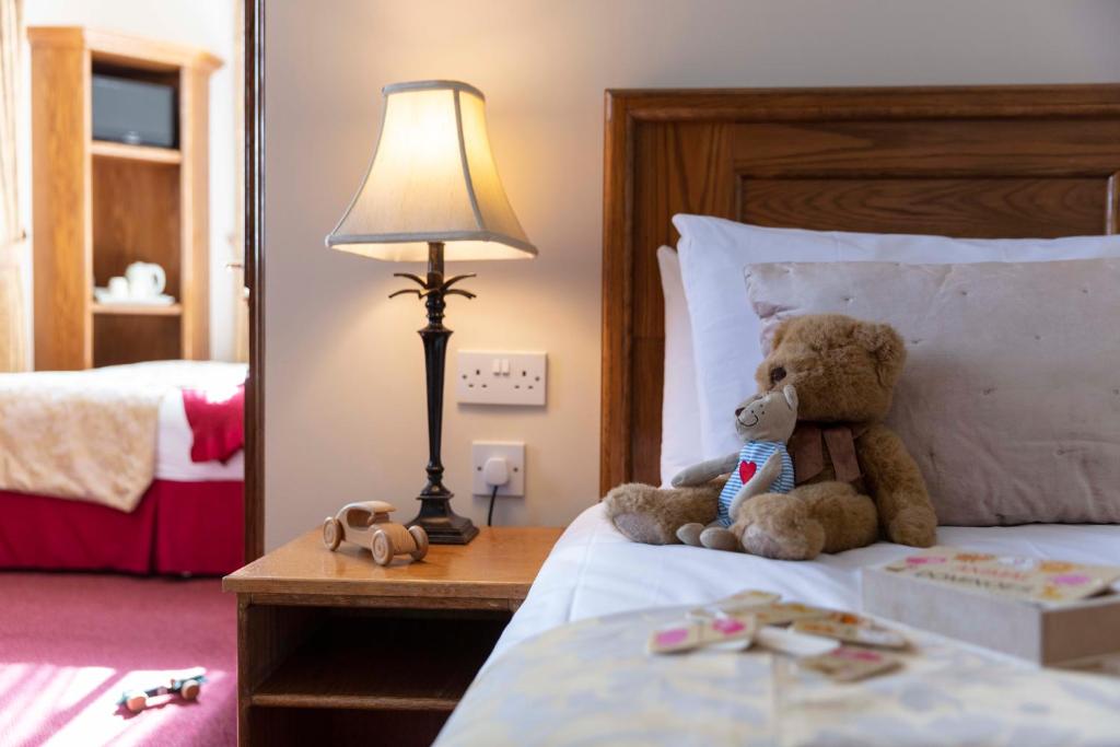 Postel nebo postele na pokoji v ubytování Scholars Townhouse Hotel