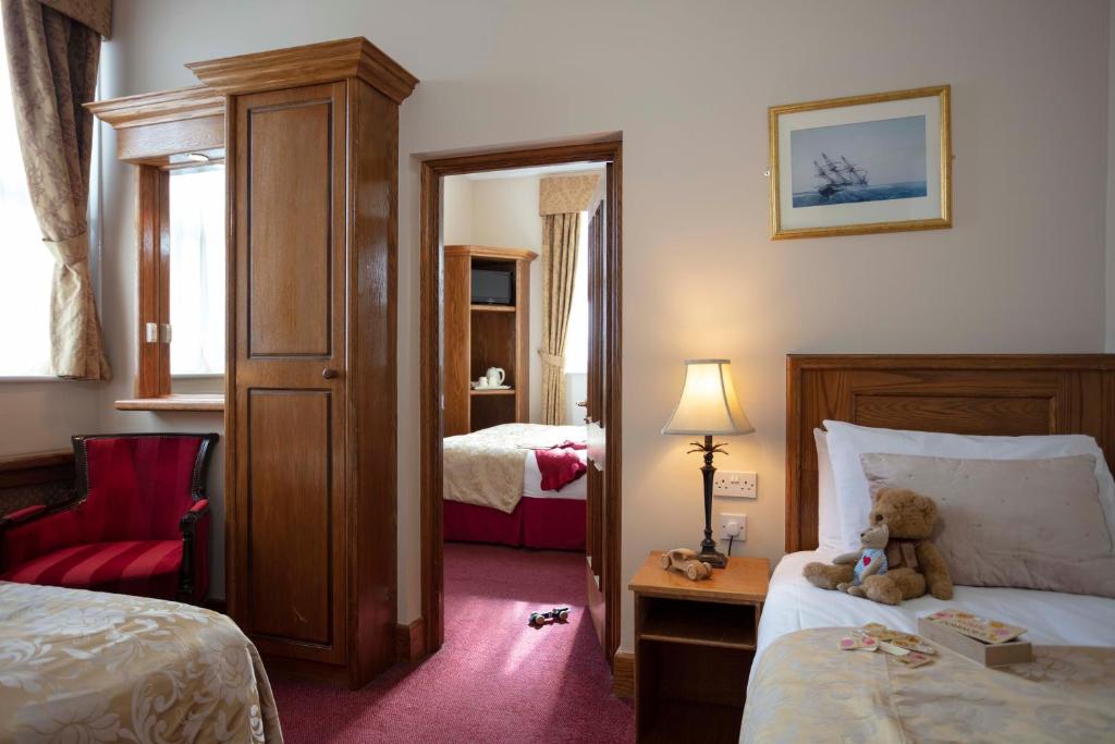 Postel nebo postele na pokoji v ubytování Scholars Townhouse Hotel