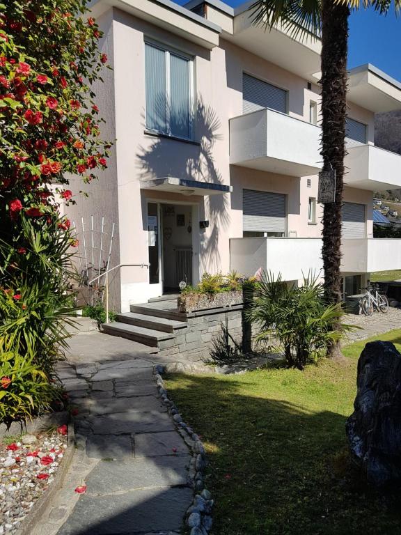 a building with a walkway in front of it at Garni Elisabetta in Gordola