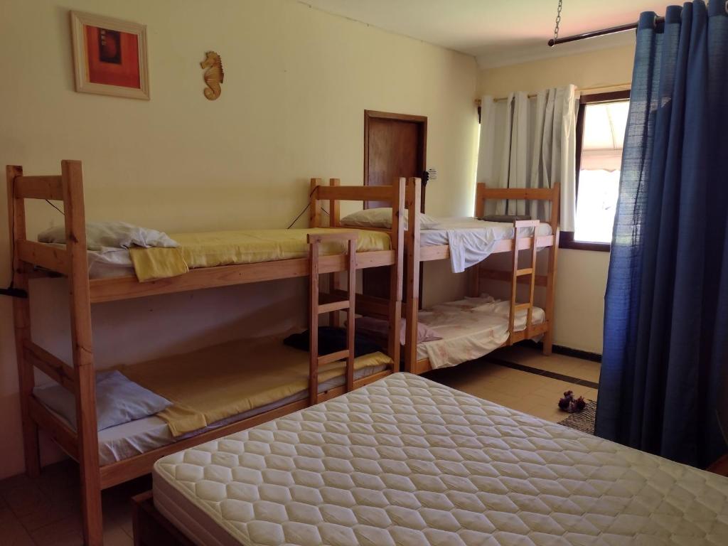  ALOHA em frente a praia- Suítes privativas & hostel