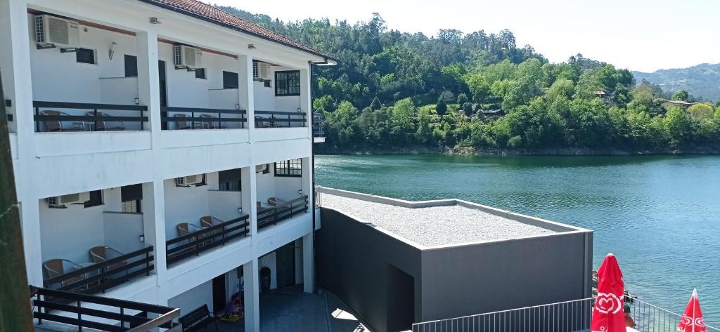 arial view of a building with a view of a river at Beira Rio do Gerês in Geres