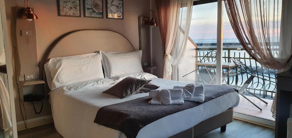 Postel nebo postele na pokoji v ubytování Hotel Zia Piera