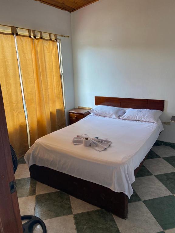 Postel nebo postele na pokoji v ubytování Hotel Policarpa