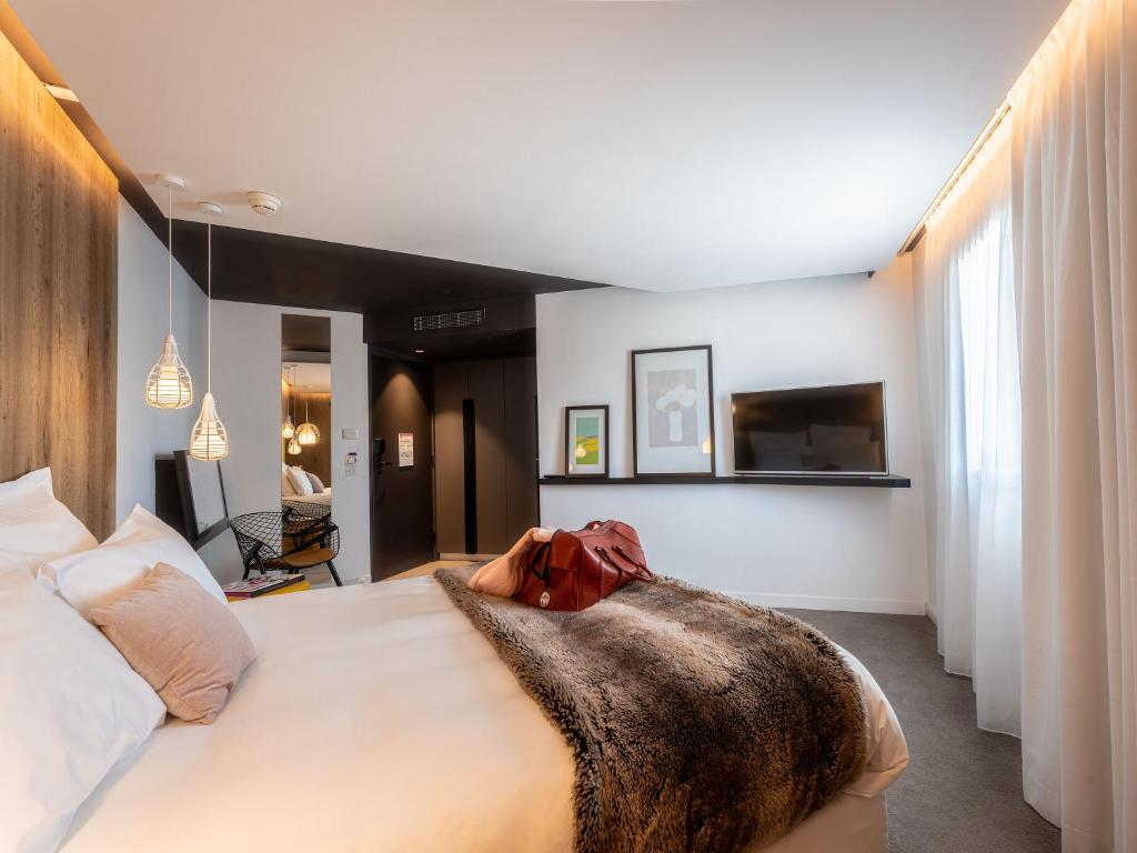 Postel nebo postele na pokoji v ubytování Mercure Valence