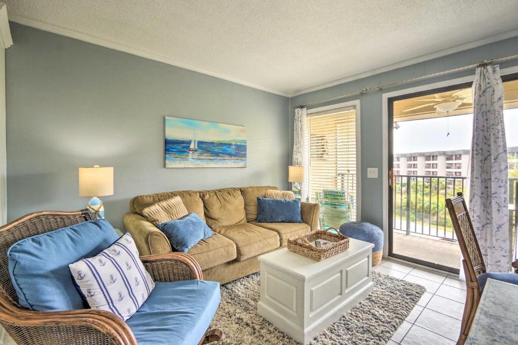 a living room with a couch and a window at Steps to Beach Ocean-View Hilton Head Villa! in Hilton Head Island
