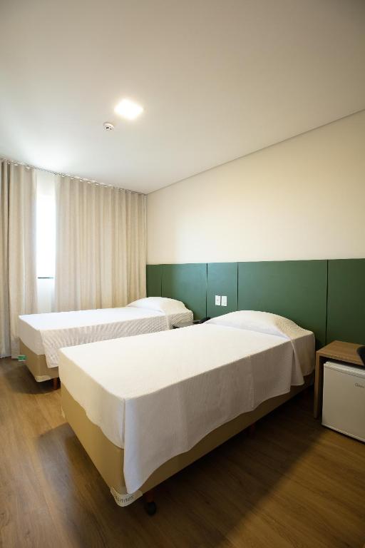 Postel nebo postele na pokoji v ubytování Viale Iguassu Hotel