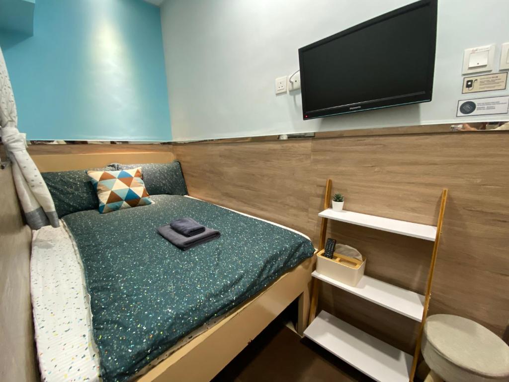 Postel nebo postele na pokoji v ubytování Royal Paris Guest House 皇家巴黎賓館