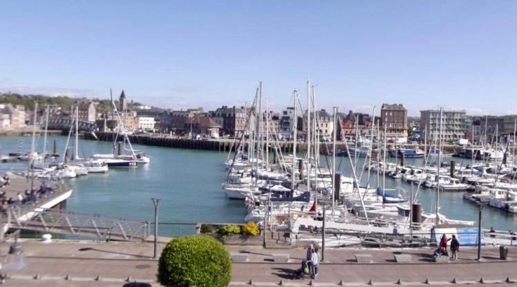 a group of boats docked in a harbor at Le Quai 7 3e in Dieppe