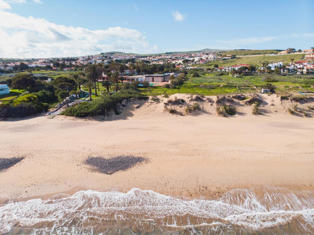 an aerial view of a beach with a town in the background at Hotel Porto Santo & Spa in Porto Santo