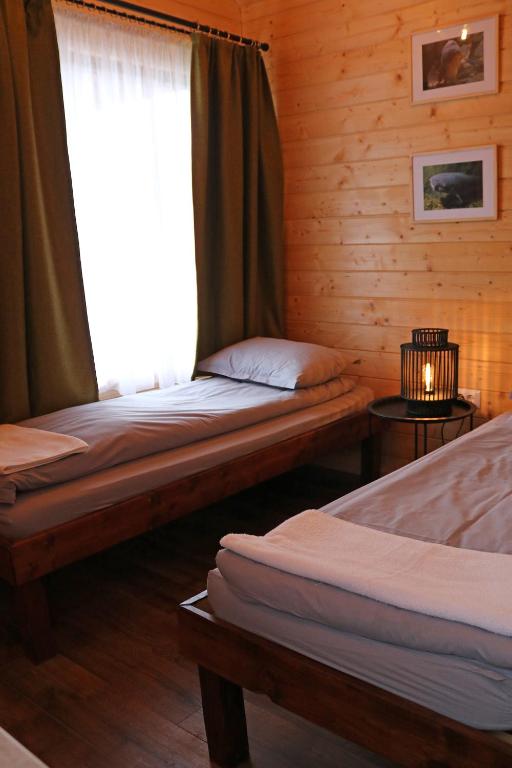 Postel nebo postele na pokoji v ubytování Cabanute Premium de pescuit