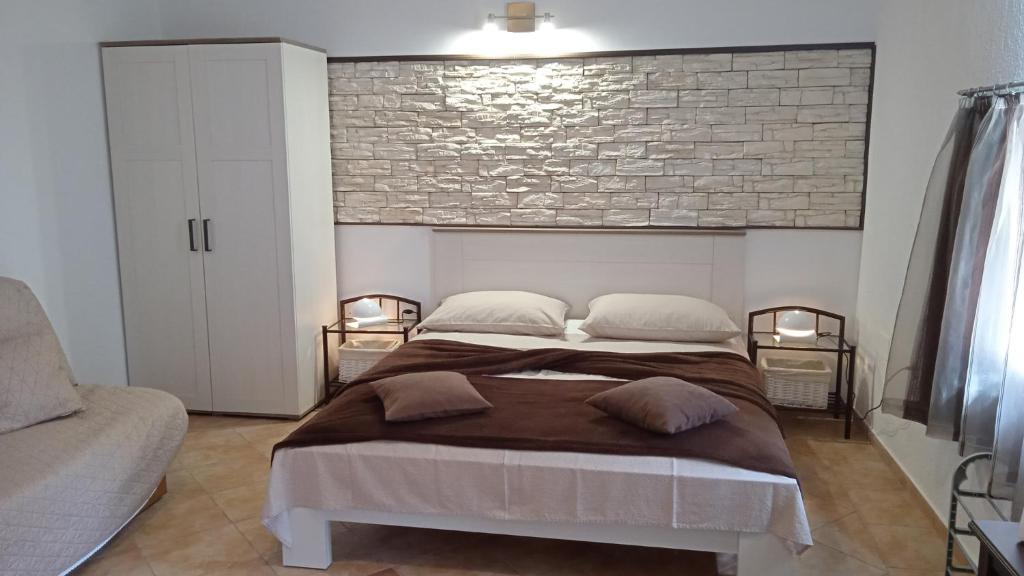 Postel nebo postele na pokoji v ubytování Apartments Janjac
