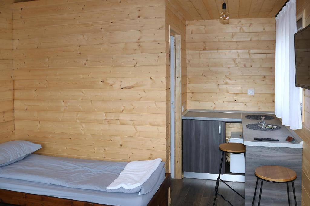 Postel nebo postele na pokoji v ubytování Cabanute Premium de pescuit