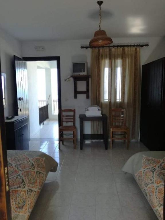 Postel nebo postele na pokoji v ubytování Olga Paltsi Rooms