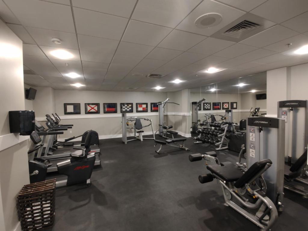 a gym with several treadmills and cardio machines at Avenue Inn & Spa in Rehoboth Beach