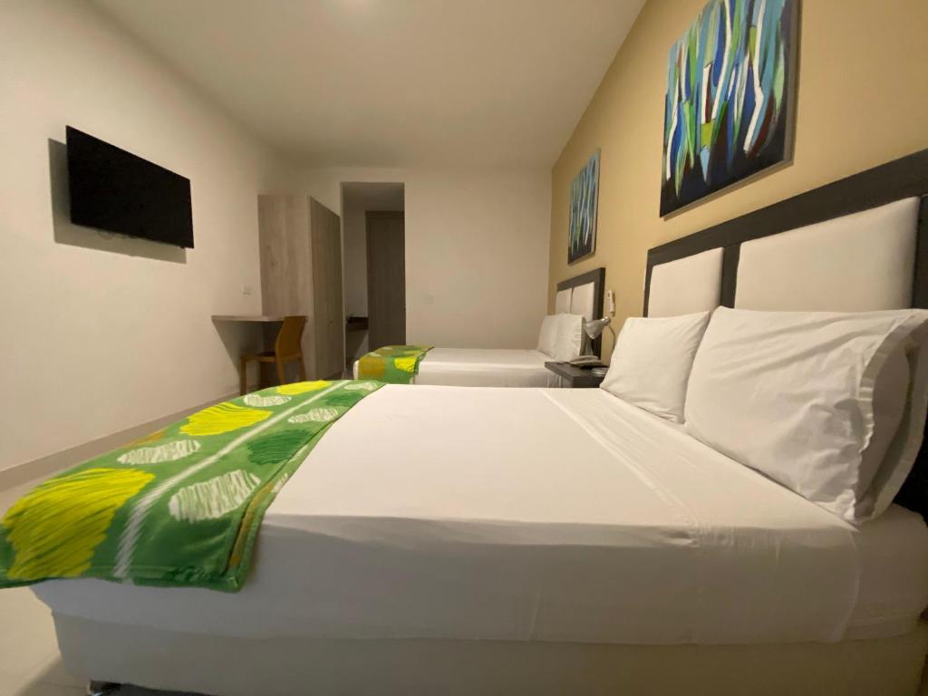 Postel nebo postele na pokoji v ubytování Hotel La Esperanza Ciudad Jardín