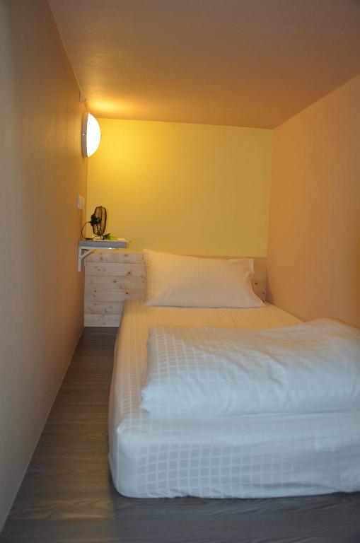 Postel nebo postele na pokoji v ubytování 綠蠵龜潛水住宿