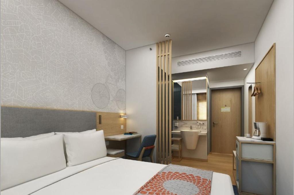 Postel nebo postele na pokoji v ubytování Holiday Inn Express Pune Pimpri by IHG