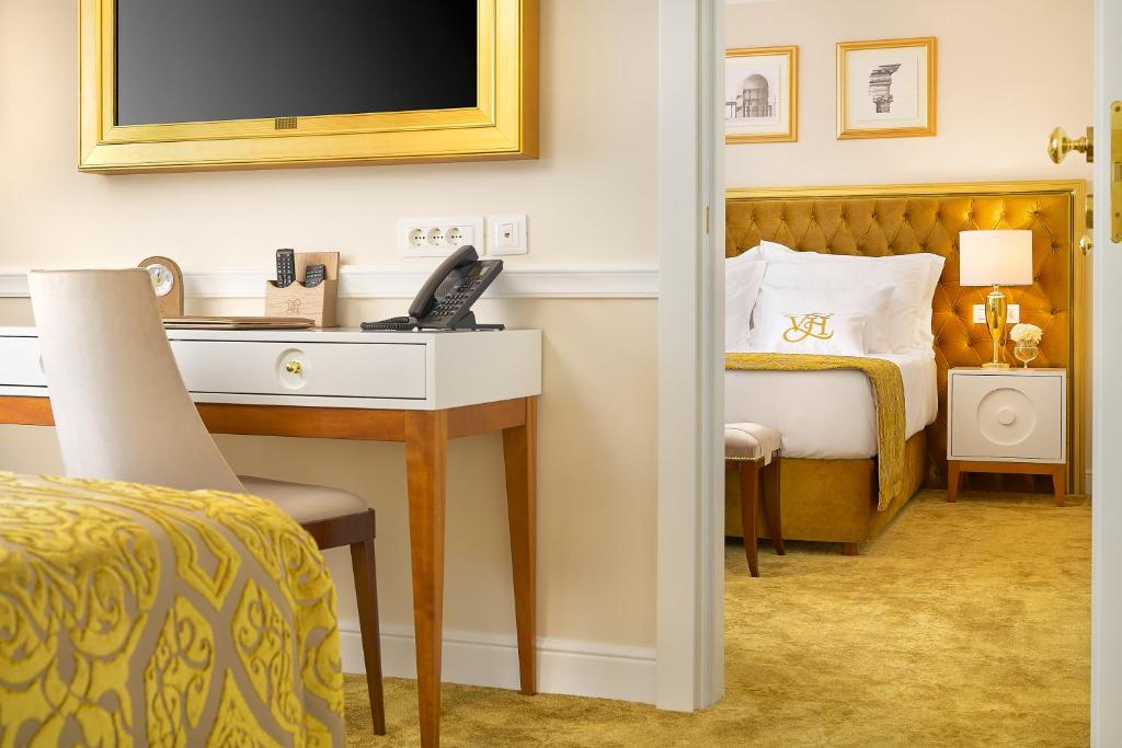 Postel nebo postele na pokoji v ubytování Hotel Villa Harmony