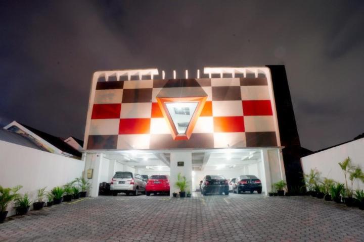 a checkered garage with cars parked in it at DPARAGON IJEN NIRWANA in Malang