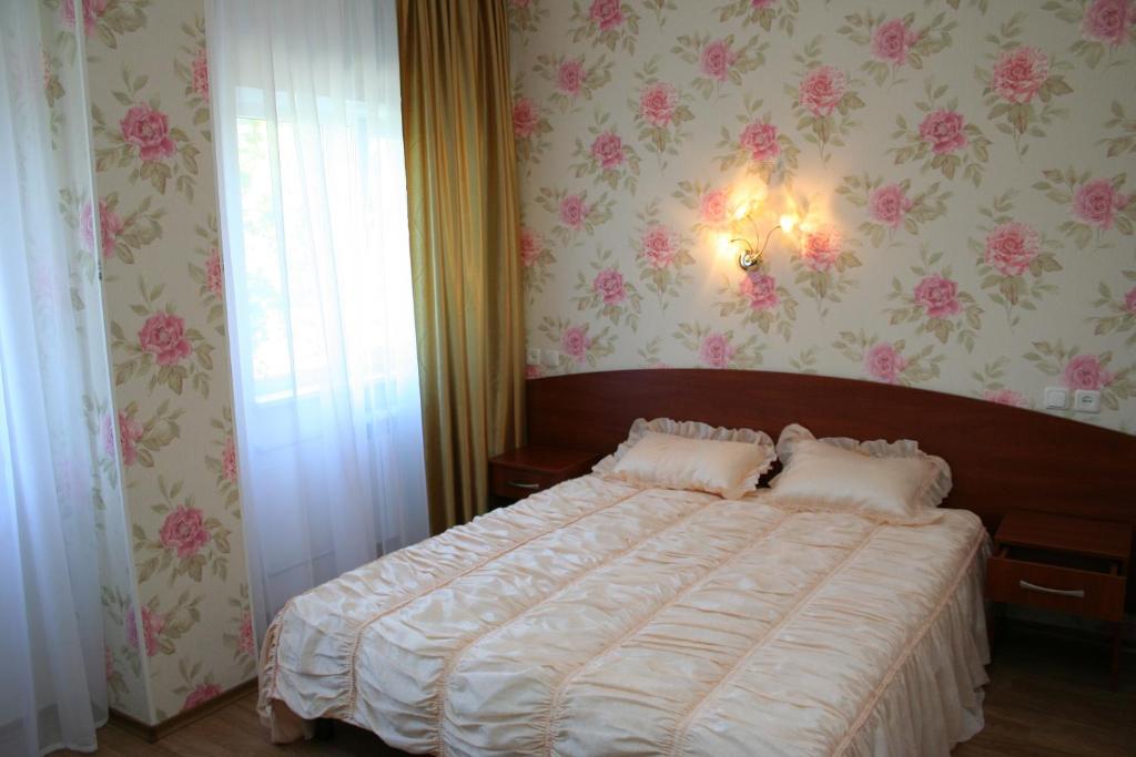 Postel nebo postele na pokoji v ubytování Hotel Aleksandria