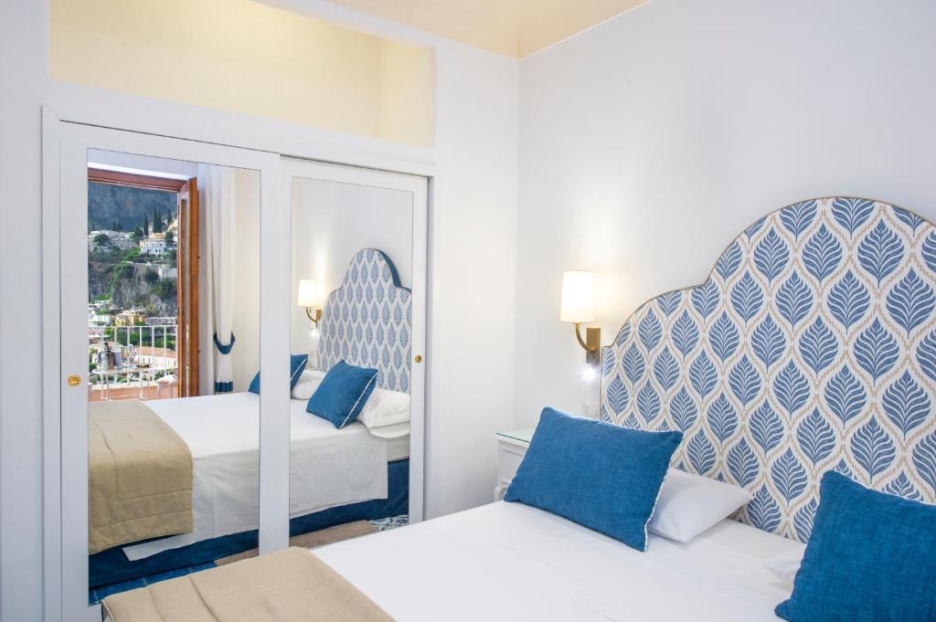 Postel nebo postele na pokoji v ubytování Hotel Casa Albertina