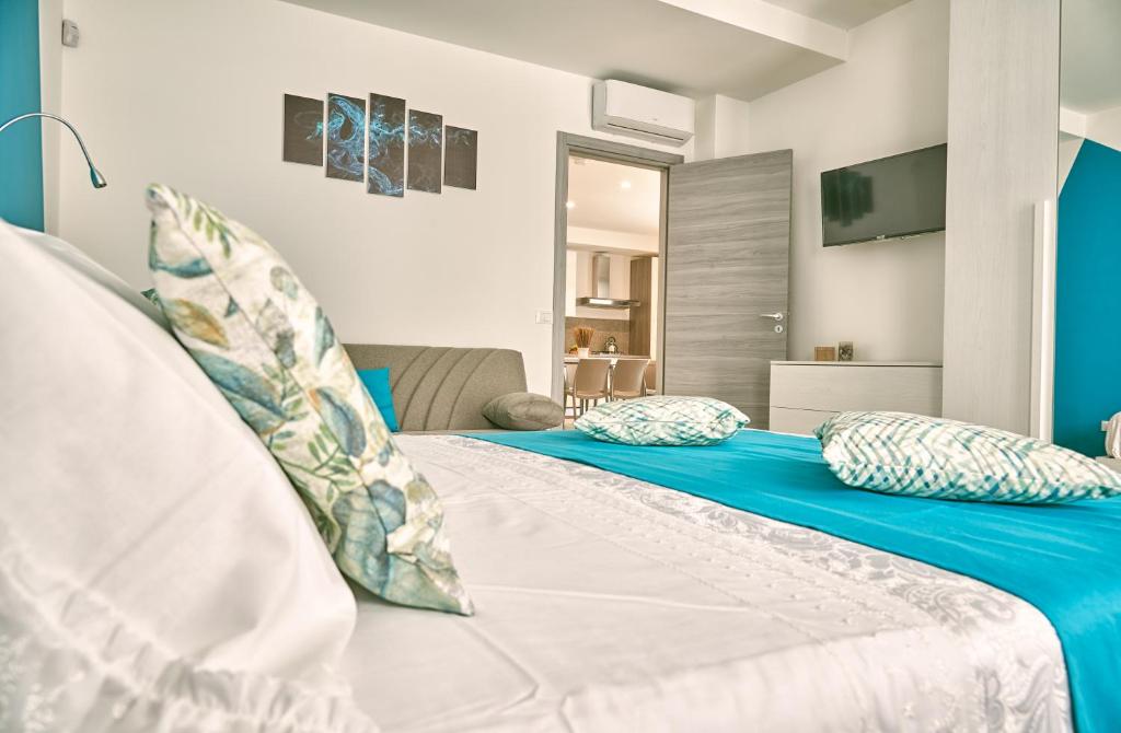 A bed or beds in a room at Il Casale di Monacella