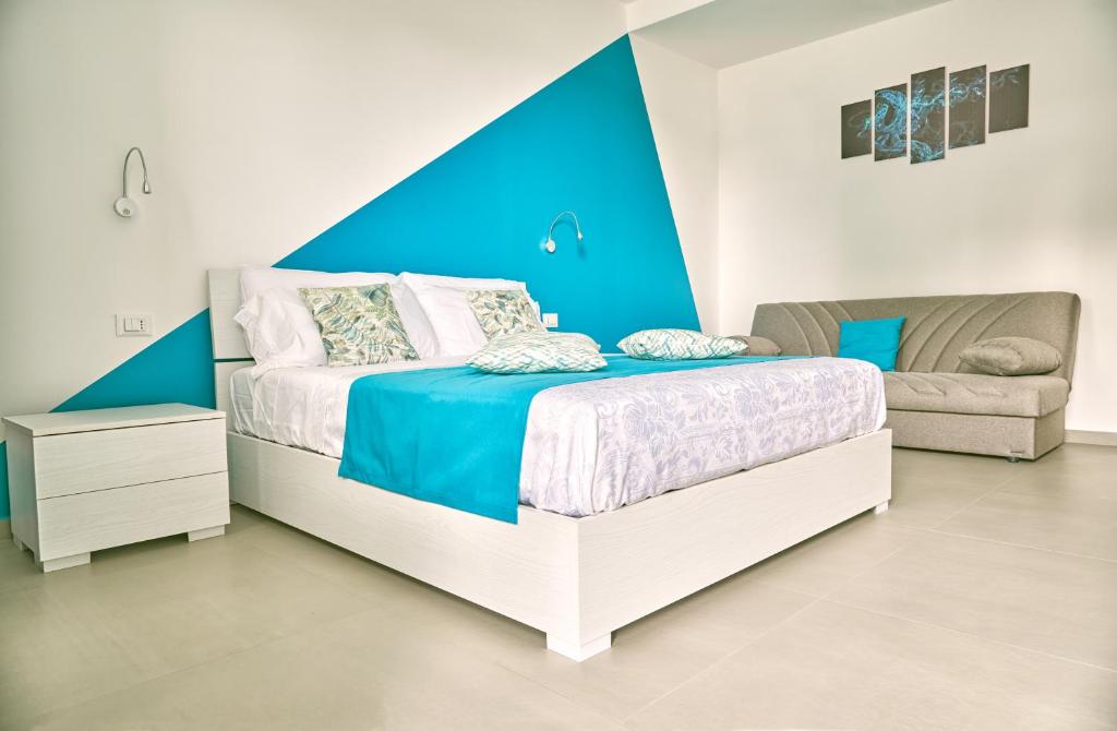 A bed or beds in a room at Il Casale di Monacella