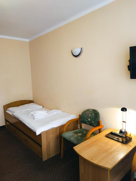Postel nebo postele na pokoji v ubytování Ośrodek Wypoczynkowy Gwarek Ustronie Morskie