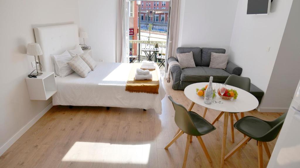 En eller flere senge i et værelse på Premium Historic Center & Parking