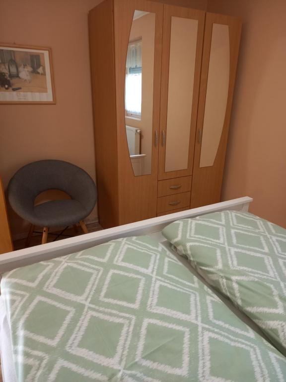 Postel nebo postele na pokoji v ubytování Dűlő Apartmanház