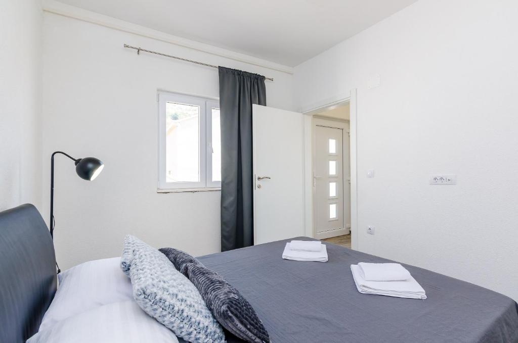 Postel nebo postele na pokoji v ubytování Apartments Life