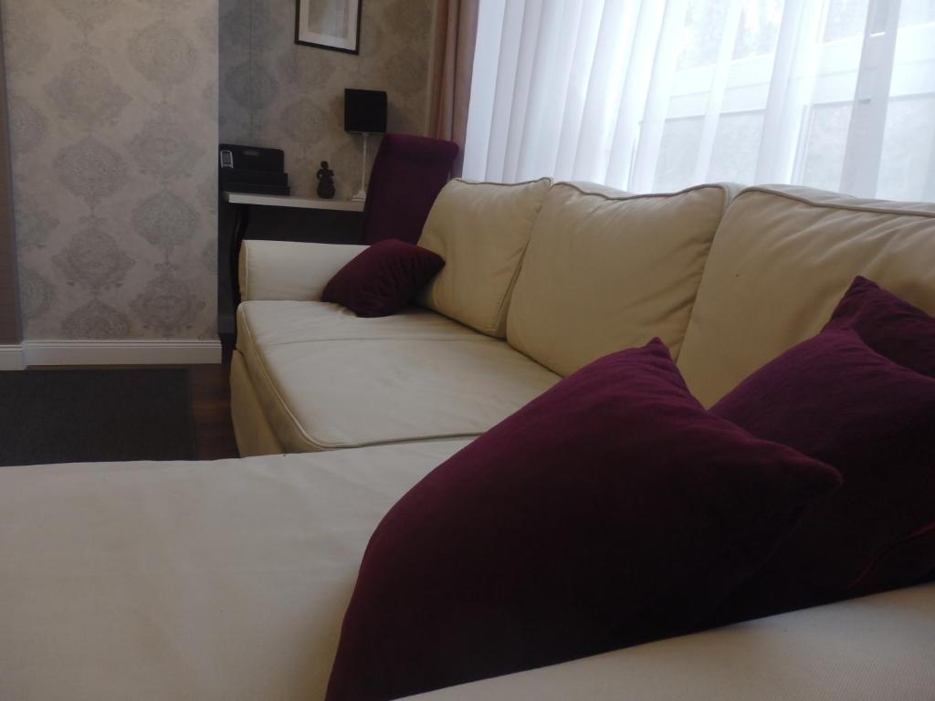 Łóżko lub łóżka w pokoju w obiekcie Zoé Apartman