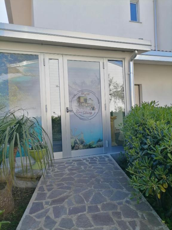 a glass door of a house with a patio at B&B Casa Dany in Ricadi